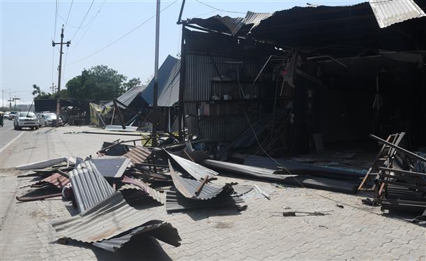 Demolition drive comes to halt as marble traders block road in Dhanas