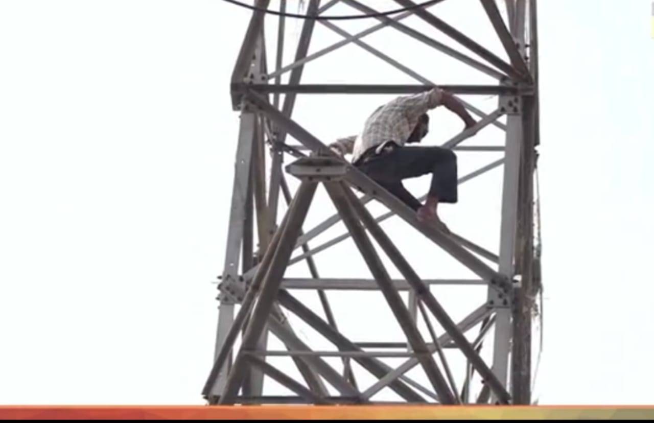 Man climbs high-voltage electric tower in Gate Hakiman Wala area