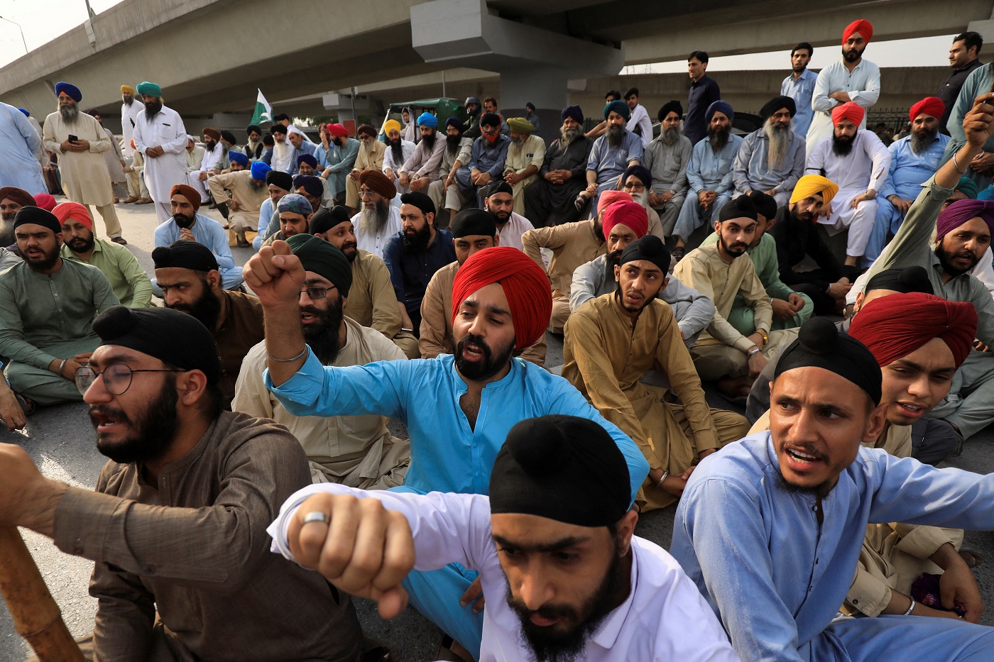 Local residents join enraged Sikh community members to protest against killing of two traders in northwest Pakistan