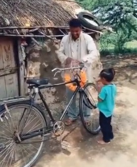 Father-son duo celebrates after buying second-hand bicycle, see heartfelt video