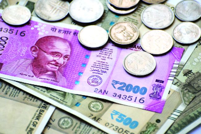 Rupee hits new low, slumps 14 paise to 77.69 against US dollar in early trade