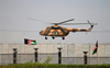 Taliban commander takes his newlywed bride home in military chopper