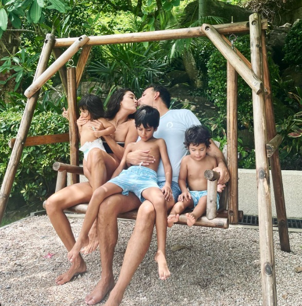 Lisa Haydon's 'quick kiss' with husband at beach during family vacation makes fan go awww