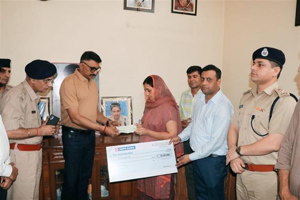 ADGP hands over Rs 65 lakh cheque to wife of slain Haryana DSP Surender Singh