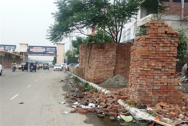 Dumping of construction material poses threat to commuters