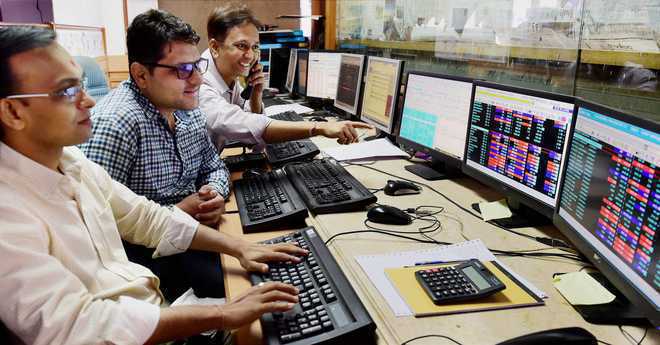 Sensex, Nifty settle modestly lower in volatile trade