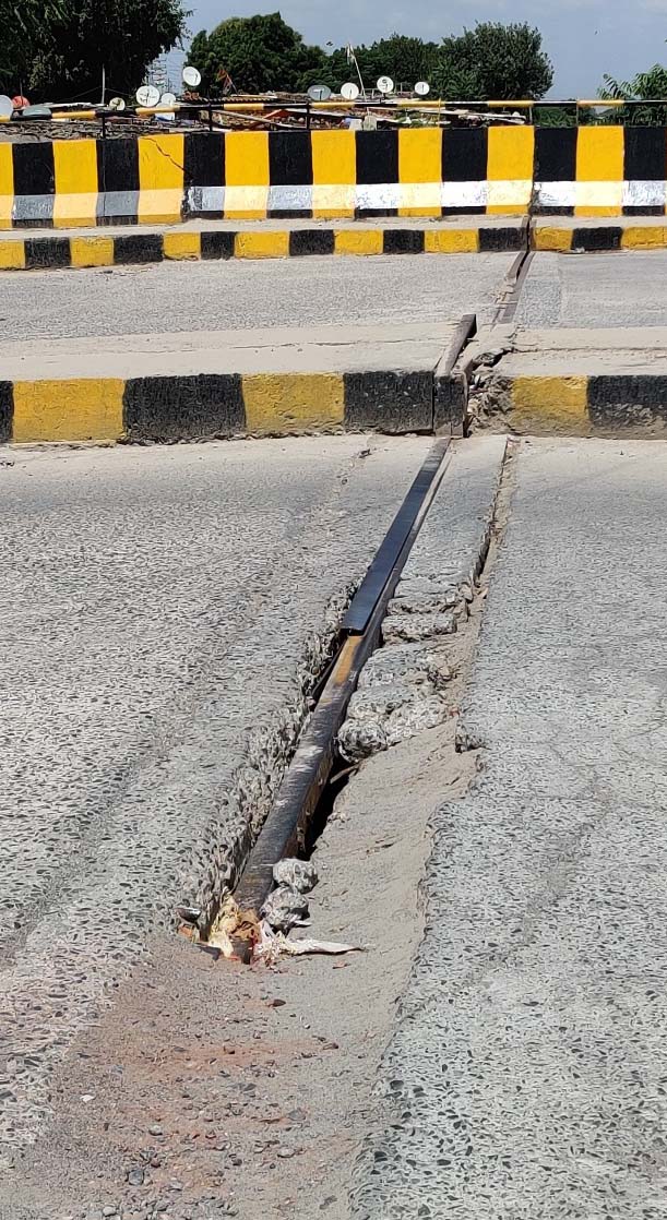 Damaged bridge road poses risk to commuters