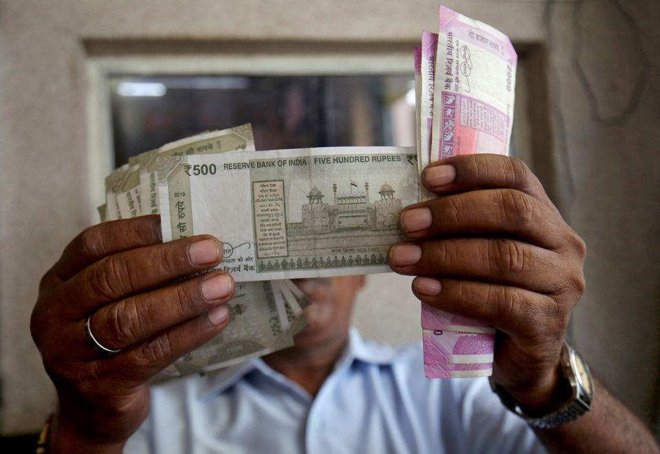 Rupee plunges to end at record low of 80.79/USD