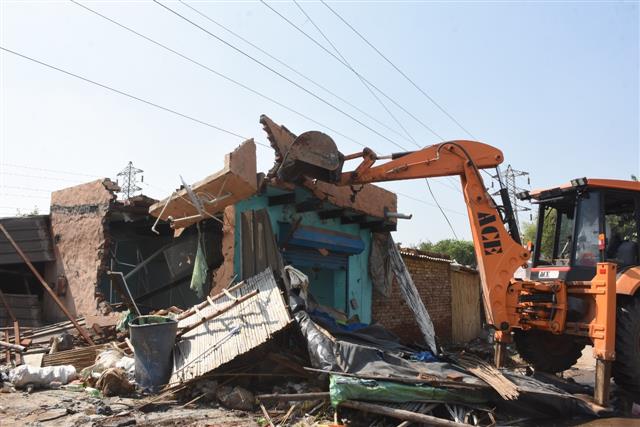 Illegal properties of drug peddler, kin demolished in Faridabad
