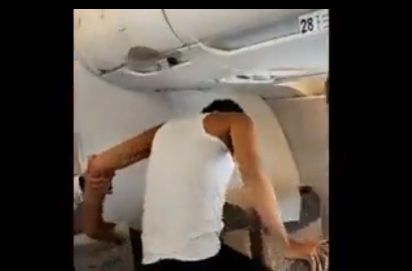 Video: Pakistani passenger strips on flight to Dubai, kicks window, punches seats