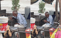 Elderly man counting his daily earnings in his shack breaks hearts online