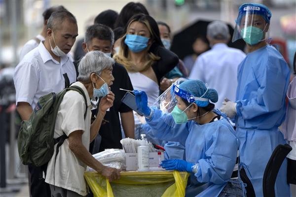 China reports almost 60,000 Covid-related deaths