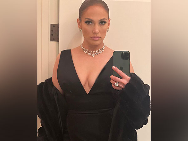 Watch: Jennifer Lopez rings in 2023 with sips of wine, cupcake