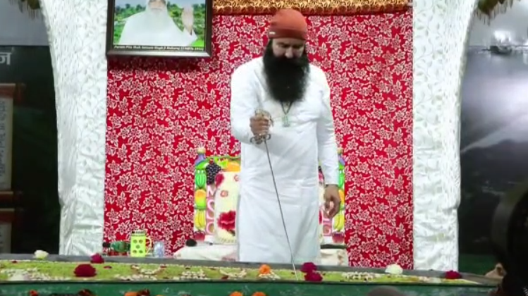 Out on parole, Dera chief Gurmeet Ram Rahim cuts cake with sword; video goes viral