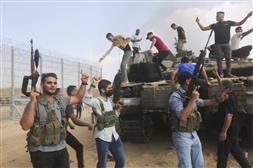 Hamas says it is holding dozens of Israeli soldiers captured in surprise incursion