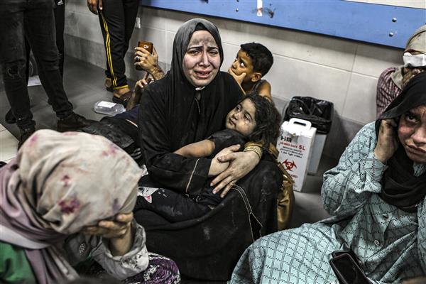 Thousands flee Gaza's main hospital but hundreds, including babies, still trapped by fighting Deir al-Balah