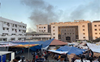 Heavy fighting rages near main Gaza hospital and people trapped inside say they cannot flee
