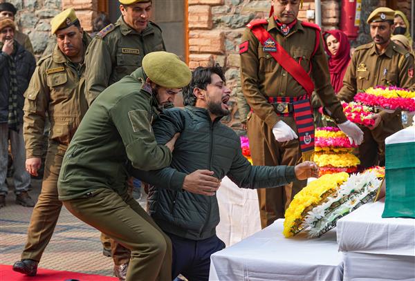 A salute and one last kiss: Family and colleagues bid tearful adieu to Kashmir Police officer