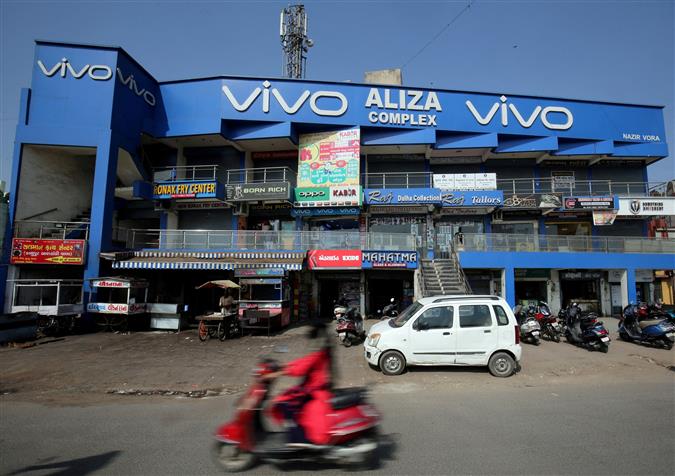 China to provide consular protection to Vivo employees held in India; says firmly backs rights of its businesses