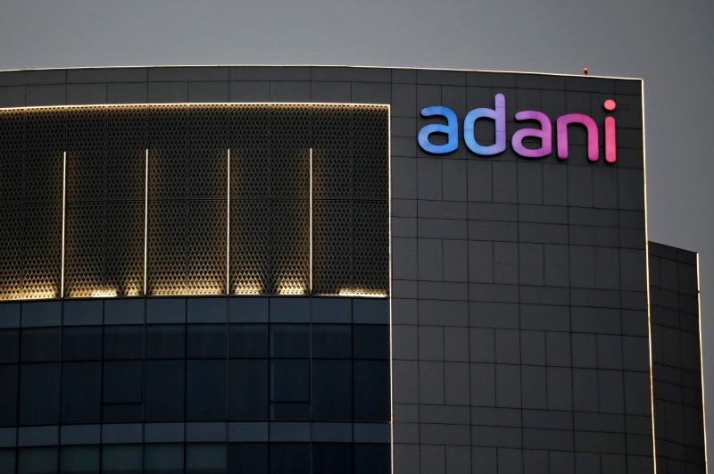 Amid volatility, eight Adani stocks settle with gains
