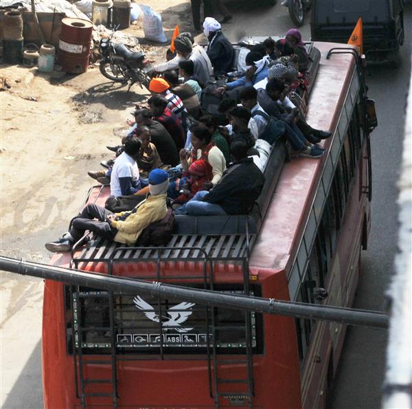 Passenger safety goes for a toss as devotees travel atop buses, trucks