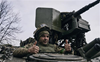 Russians claim control over Bakhmut's east, Ukrainians defiant