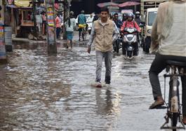 Waterlogged roads trouble commuters after rain in city