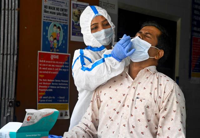 India logs 9,355 fresh covid infections; active cases dip to 57,410