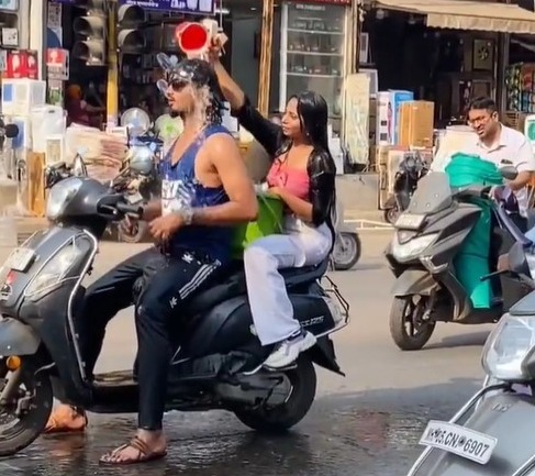 Video of couple bathing while riding scooter in Maharashtra’s Ulhasnagar goes viral, police case registered