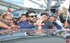 Ram Charan's fans give away bottles of buttermilk to people around Shankar Temple in Mumbai
