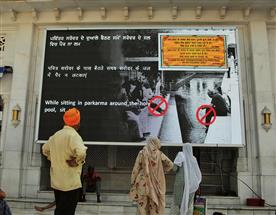 At Golden Temple entrance, big digital screen to guide visitors on dos, don’ts