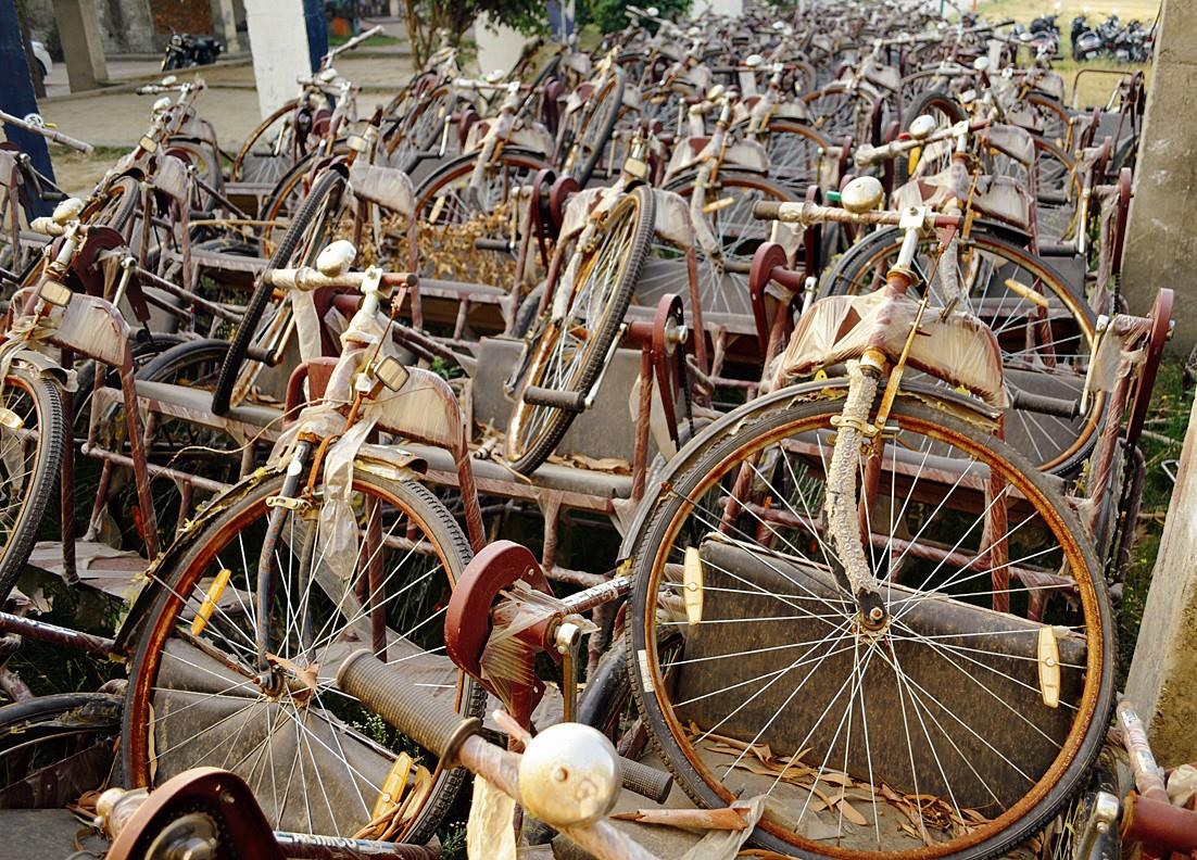 200 tricycles meant for disabled gathering dust in the open area