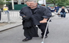 Alec Baldwin steps out with cane after hip surgery