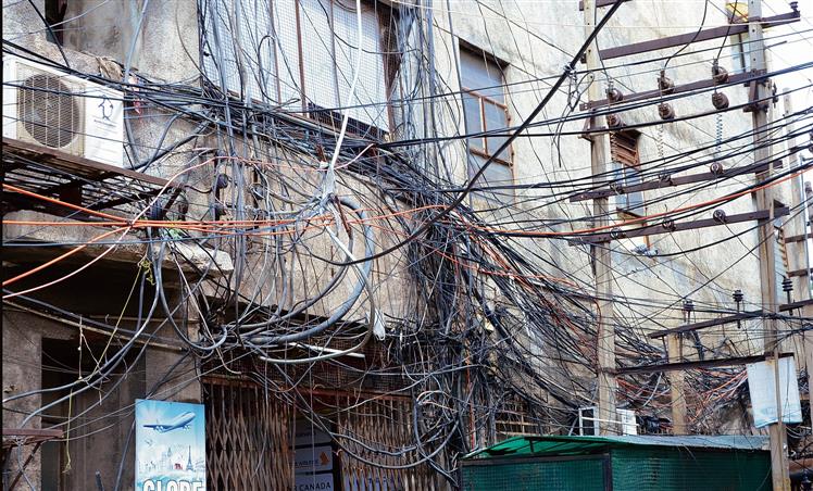 Open House:  What can be done to address the issue of dangling electricity and cable wires across city?