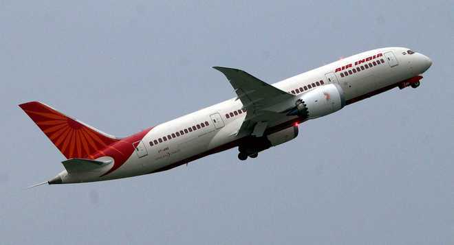 Nepal national assaults crew onboard Air India's Toronto-Delhi flight,  damages lavatory door : The Tribune India