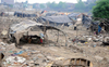 Slum dwellers struggle to rebuild shanties