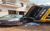 Truck falls on car, damages house wall in Kharar