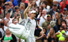 Andy Murray gets a win at rainy Wimbledon, thumbs-up from Roger Federer