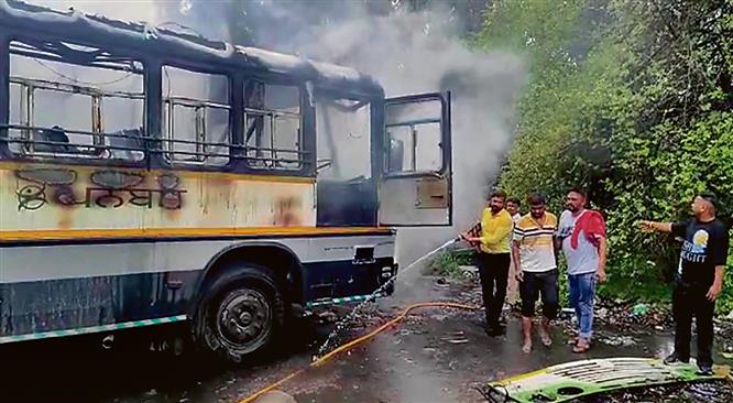Two parked buses catch fire