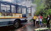Two parked buses catch fire