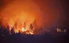 Thousands flee raging wildfire in Canada
