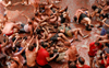 Painting town red: Revellers hurl tomatoes at each other at Spain’s annual Tomatina party