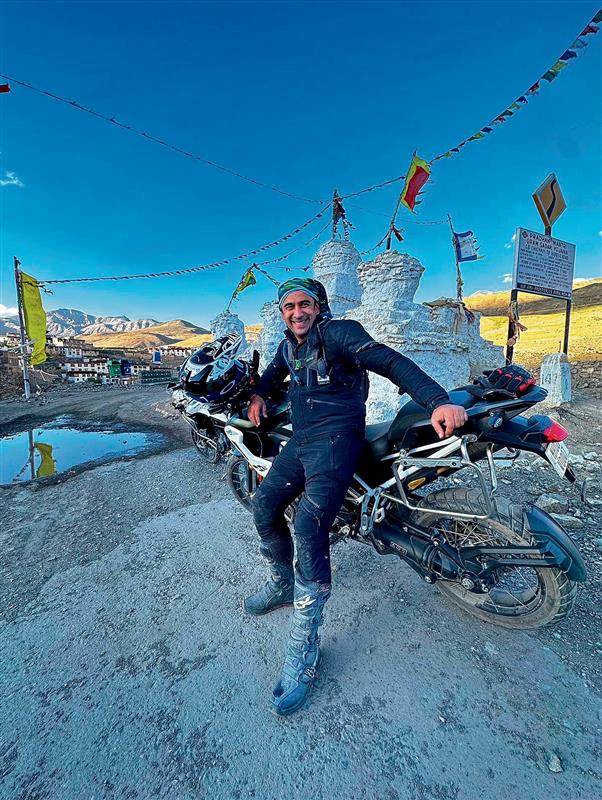 Amit Sadh cleans up part of Rakchham village during his bike expedition