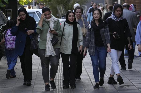 Iran’s parliament passes a stricter headscarf law days after protest anniversary