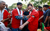 Rahul Gandhi interacts with porters at Anand Vihar railway station