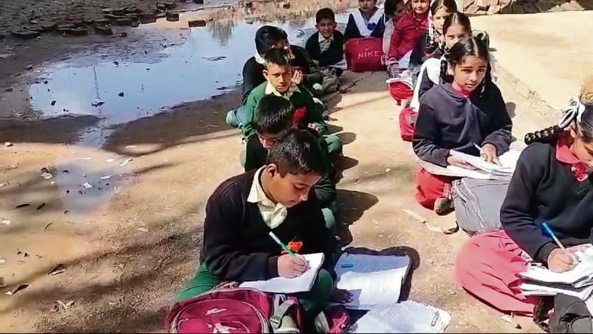 Classes taken by road project, Nurpur pupils study under sky