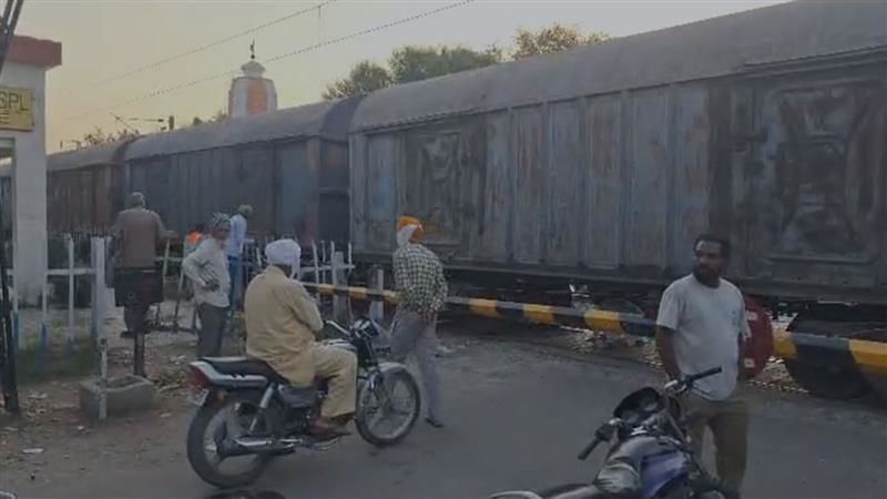 Goods train stuck at railway crossing on Issapur and Dera Bassi track; blocks connectivity to 12 villages