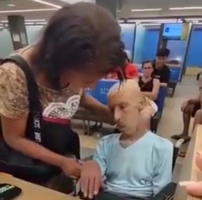 Video: Brazilian woman takes uncle's dead body on wheelchair to bank to sign for loan on his name