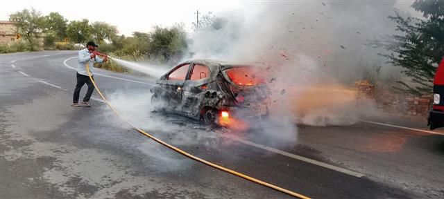 Moving car goes up in flames