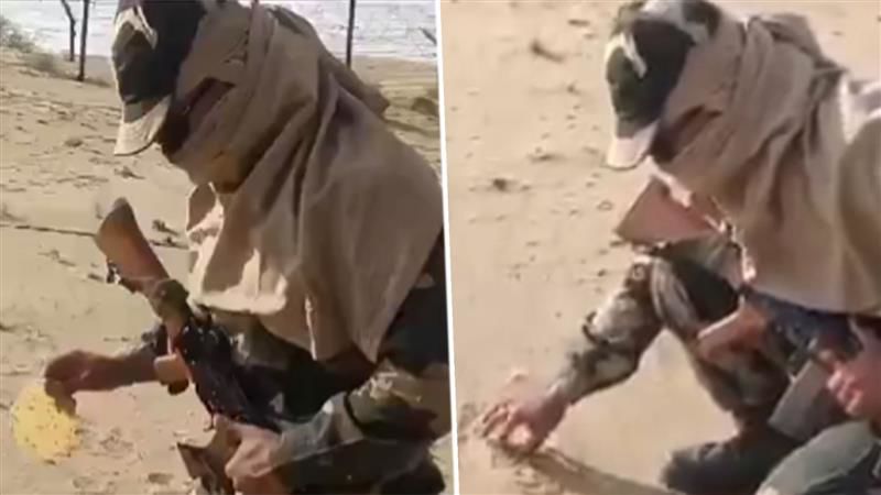 BSF jawan roasts ‘papad’ in sand amid sweltering heat in Rajasthan; netizens praise unwavering commitment of soldiers